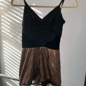 Sequined/lace body suit.